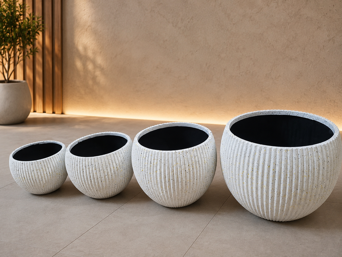 Modern round ribbed/fluted planter pots.