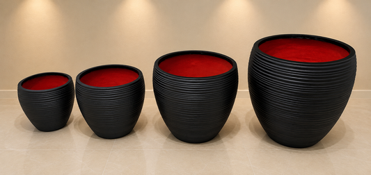 Set of four ribbed round planter pots.
